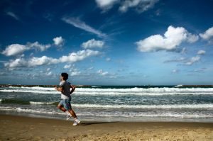 sportsman running on the beach in TelAviv